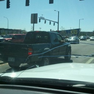 Both girls in there are smoking with 2 kids in the back..