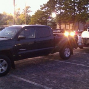 My friends 2nd gen prerunner with a grill hooked up, maybe 500 pounds or so