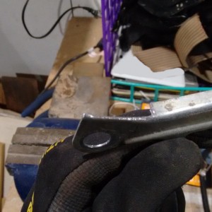 Bracket with section of tab removed