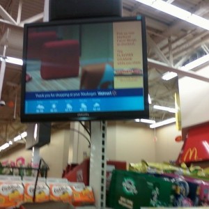 Lines soo long at wal-mart, they have a tv to watch.