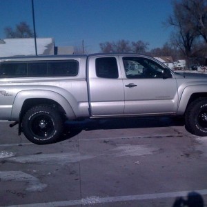 side view with new wheels and tires