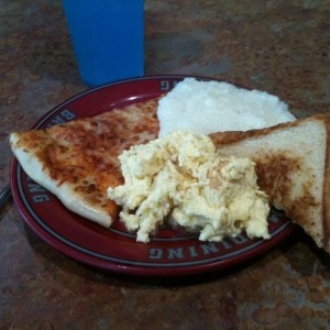 The breakfast of champions: eggs, grits, pizza, grilled cheese, blue powere