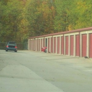 Guy is parking his bitchin bmw convertible in the storage unit. Pull the bl