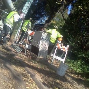 sorry for the angle, shot from the hip! . . . 1 guy working, 6 guys standin