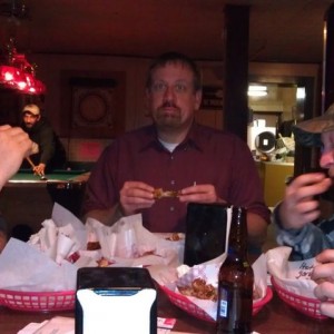 Homer is actually eating wings!