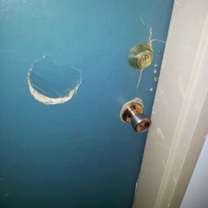 Damage from gang unit cops busting open neighbors door yesterday This messa