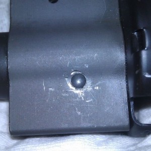 Anyone know how to remove the pins on a front sight block?