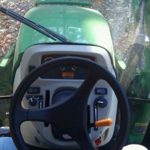 Interior. 3 cylinder diesel ~40hp I think, air con, hydrostatic drive, air 