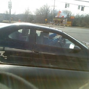 Parent of the year!!! kids in the back one without a car seat and the other