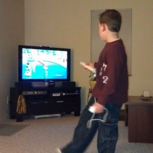 6 yo son playing Wipeout on Wii. You shoot other players with tennis balls.