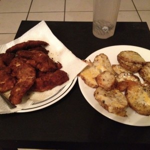 Homemade fried chicken and fried potatoes with cheese! Yeeaahhhhh