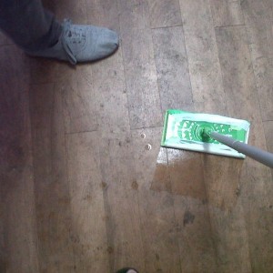 You are looking at a mop and you are looking at the floor. You are also wit