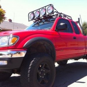 red tacoma with roof rake hids hella 5000s