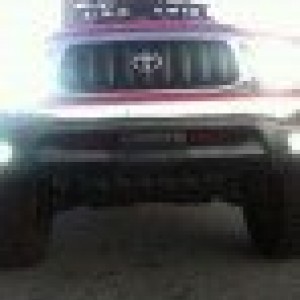 red tacoma with roof rake hids hella 5000s