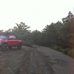 red tacoma with roof rake hids hella 5000s