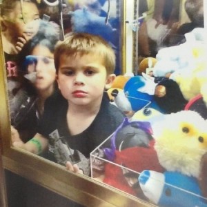 Kid got stuck in the claw machine in the Orange County Sky High Sports (my 