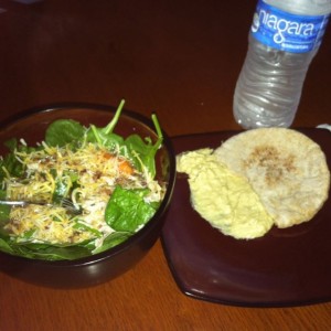 Spinach salad with cheese celery carrots grilled chicken and raspberry waln