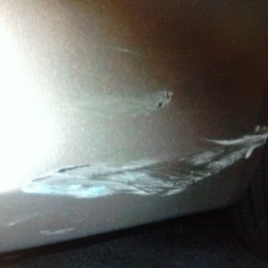 I'm writing a vehicle damage report for this chick and I tell her that