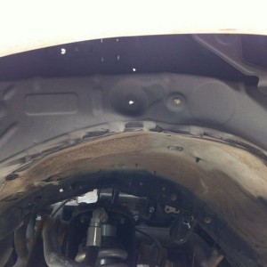 Tire smashed the wheel well
