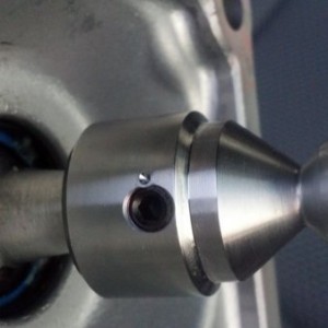 Insert new end piece, red loctite the screw and punch a hole here to keep i