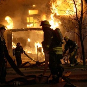 That's me in the center at a house fire involving two houses. First on