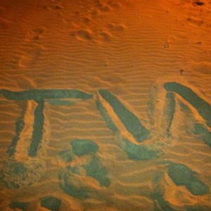 Tacoma world in the sand.
