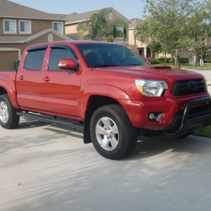 2012 Barcelona Red TRD Sport DC with blacked out toyota emblem