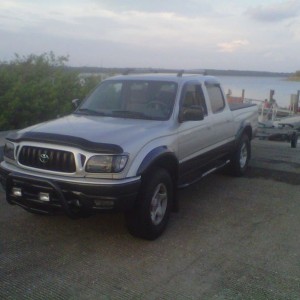 The boat is in the water. Camping at Lake Manatee.