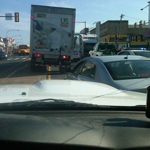 Trash truck vs car. Truck won. 1hr delay because cars no jump center divide