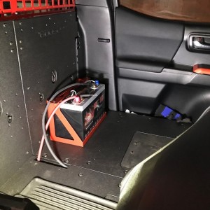 Battery relocated in rear cab area