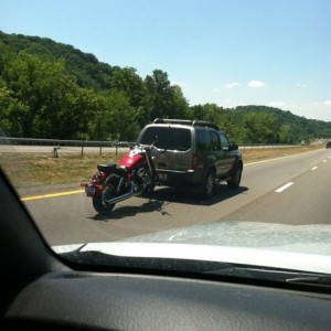 Sketchy ass way to tow a bike! At least IMO