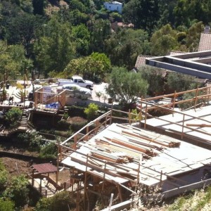House on the side of a hill going up. I can only imagine the red tape