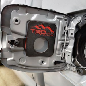 Gas cap holder #2.1: Reduced hole diameter, added strength to mounting tab and cap fit great