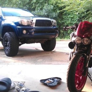 Working on the Buell in the rain.