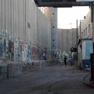 Here's an idea how tall the wall is that is prisoning the Palestinians