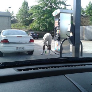 Dude, pulled up on the wrong side for his gas tank, after dumping gas all o