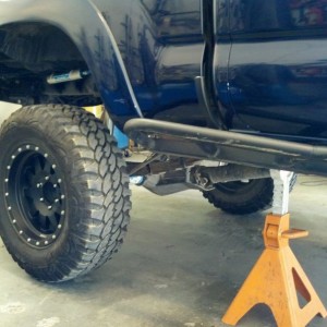 On the 4th notch of 12 ton jack stands and the rear tires are on the ground