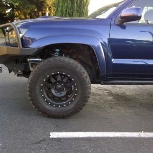 Cut 2.5" off the fender and the flares.