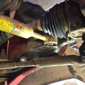 How do I get the cv out of the way? I can't get this shock out.