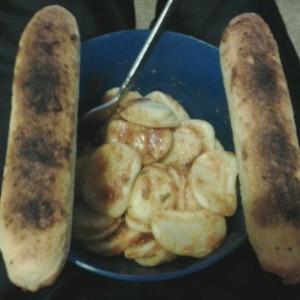 Cheese ravioli with mushroom sauce and cheese sticks