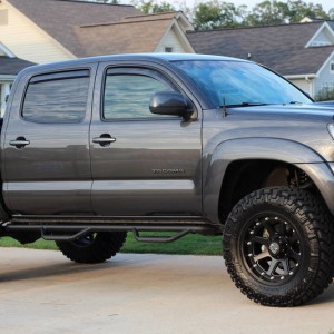 3" ProComp Lift, 18" XD Addicts, N-Fab Steps, 33" Nitto Trai