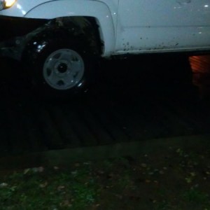 Taco on deck. Water in back of it is road. No way out except by foot now.