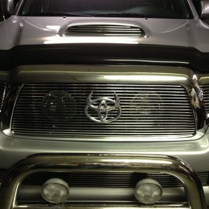 My new chrome billet grill with my bamf light bar and hella fogs for now ne
