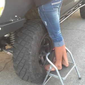True mechanic in the making..wrenching while barefooted