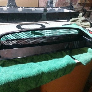 Hood scoop with backing removed