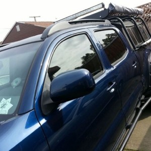 Installed oem roof rack. And temporarily relocated the light bar.