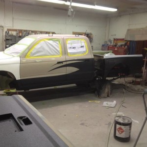 Getting the bedliner paint job done after the GU fiberglass installed.