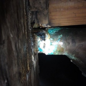 Plumber help, is this copper pipe? That dark spot is a rotted hole in a dra