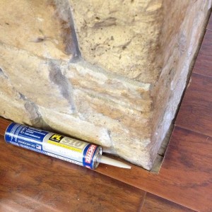 FAT. Gap between my flooring and fireplace. Going to fill it in with gray c