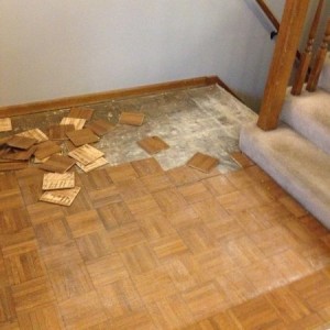 Out with the 80's flooring. I think it's called parkay, or parque